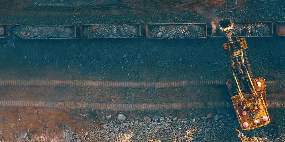 Aerial view of a mining vehicle carrying raw material.