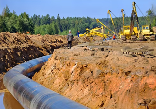 Pipeline being laid under the ground.